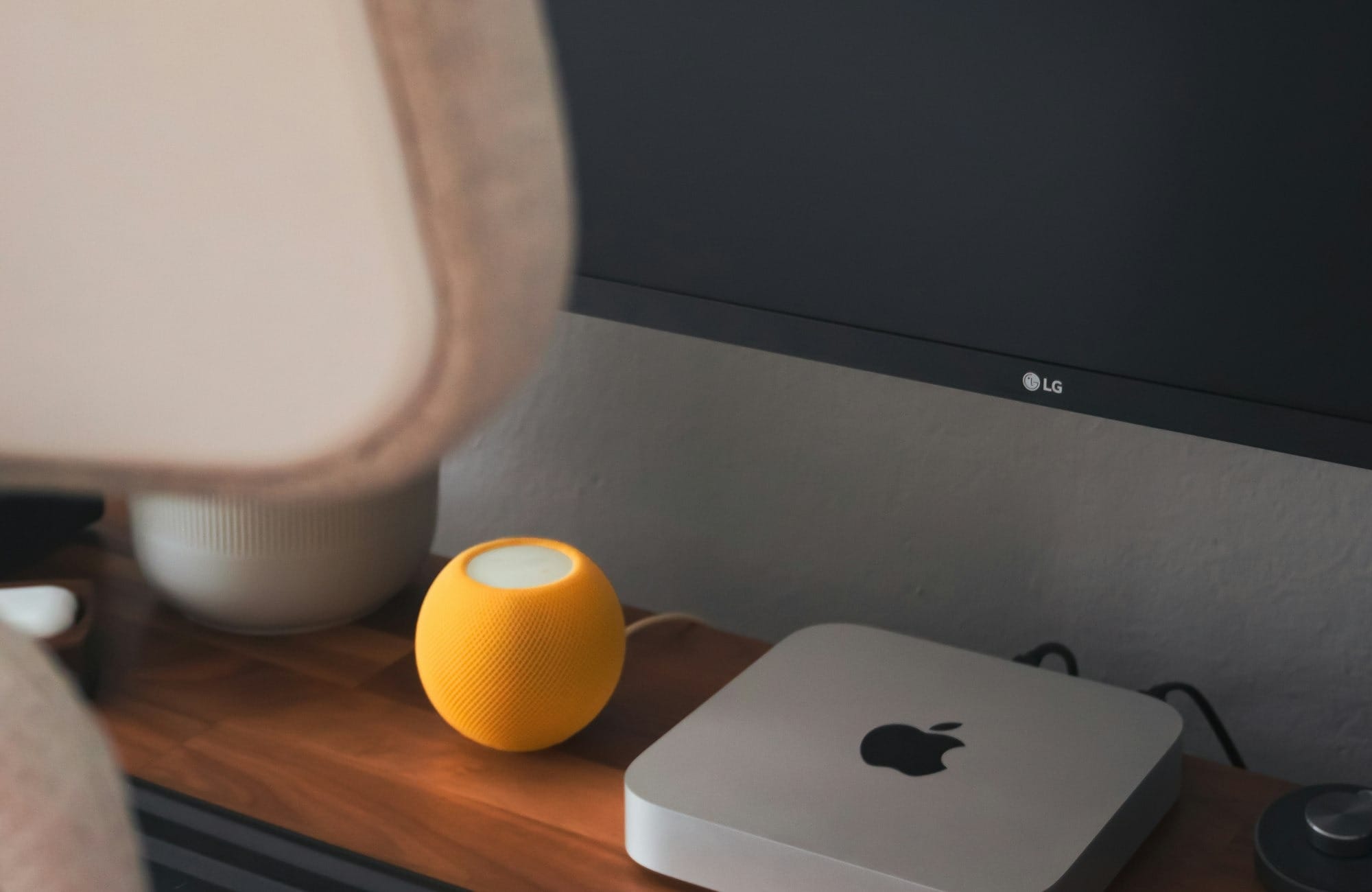 A computer monitor sitting on top of a wooden desk